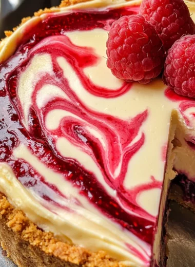 White Chocolate Raspberry Swirl Cheesecake